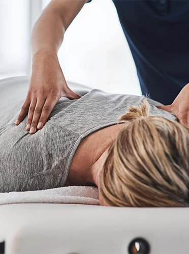 Chiropractic Equipment Brooklyn WI Woman Receiving Adjustment Chiropractic Equipment Brooklyn WI Woman Receiving Adjustment